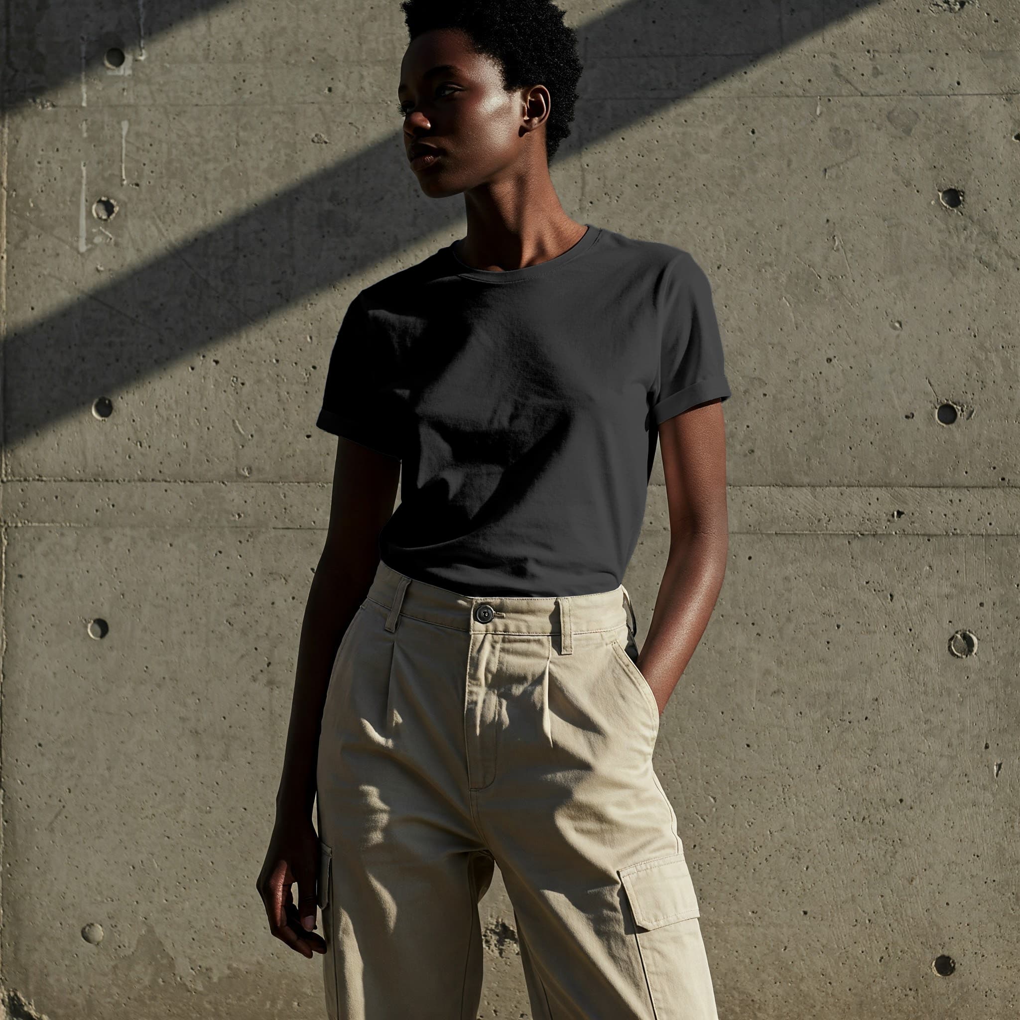 Free Black Woman White T-Shirt Online Mockup — Concrete Wall PSD mockup for Adobe Photoshop