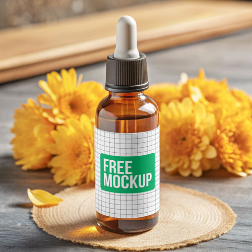 Free Amber Dropper Bottle PSD Mockup — Yellow Flowers & Rustic Coaster PSD mockup for Adobe Photoshop