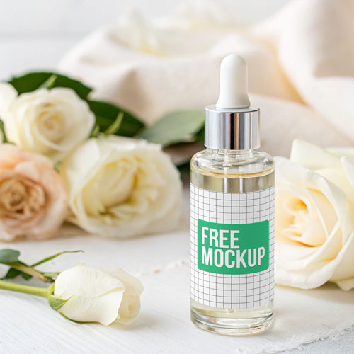 Free Elegant Clear Dropper Bottle PSD Mockup — Roses Setting PSD mockup for Adobe Photoshop