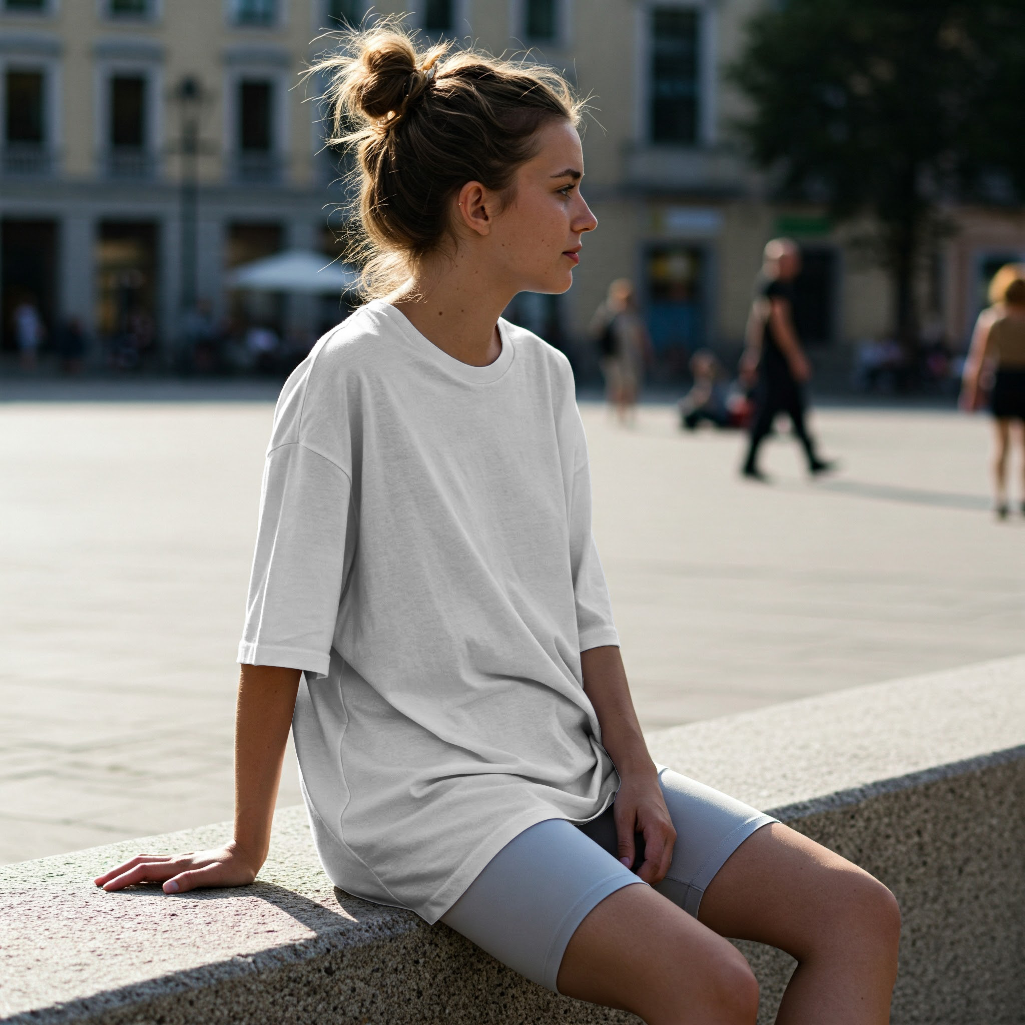 Free Online T-Shirt Mockup — Stylish Model on Urban Stone Architecture